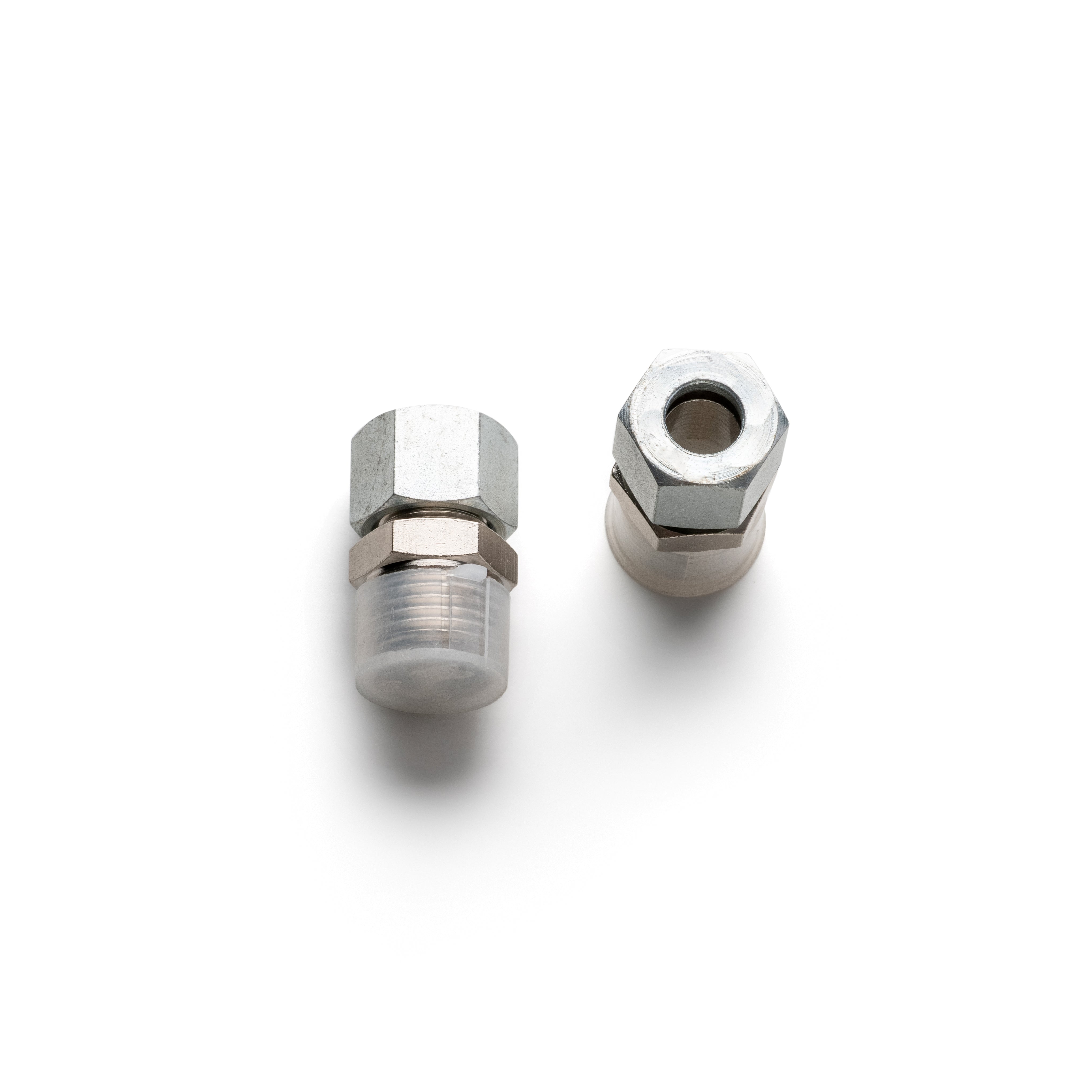 Two metal sanding nozzle bases, one for ceramic and one for tungsten carbide, with a hexagonal socket on the ceramic base and a smooth, silver-colored finish on both.