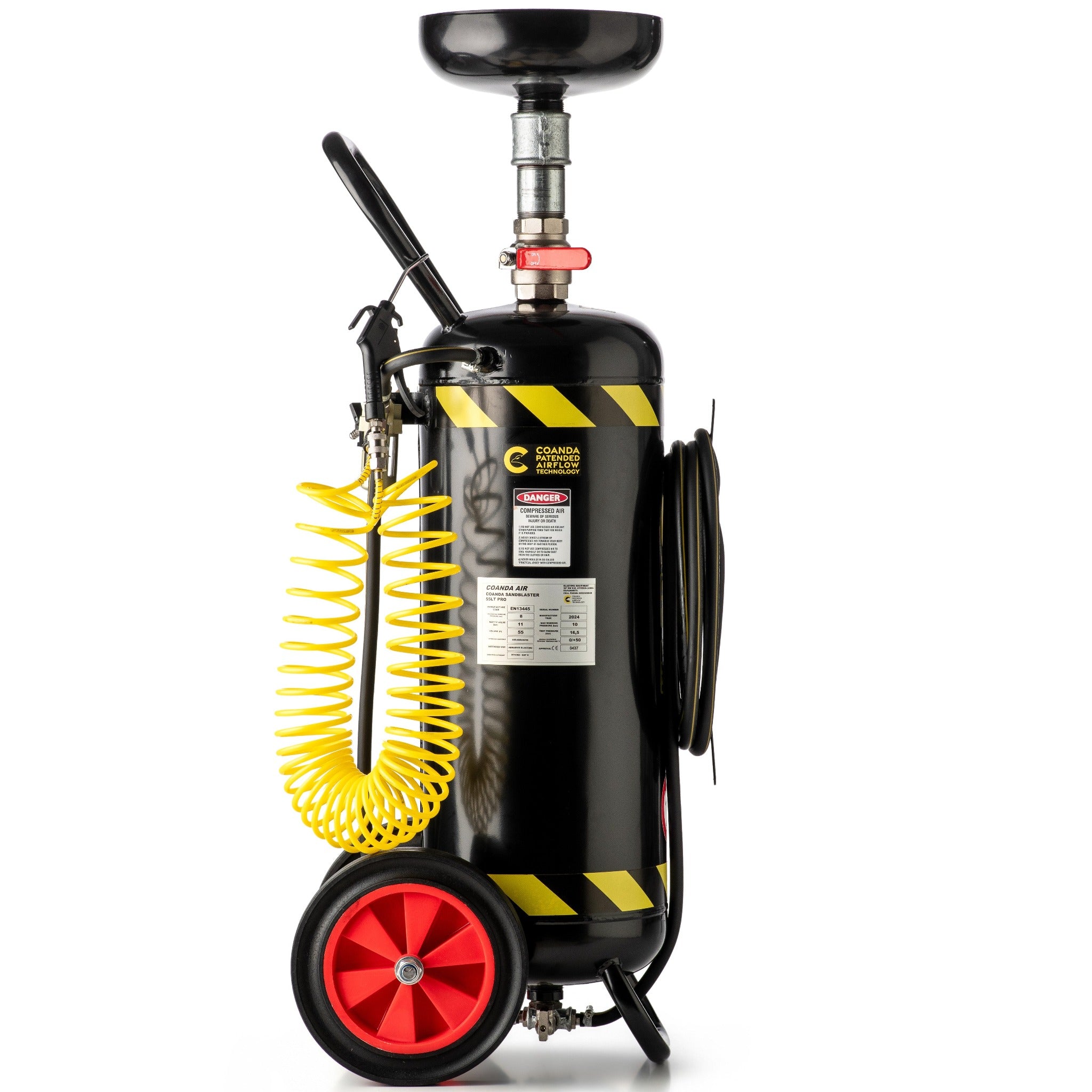A portable Coanda Sandblaster 55 Lt Pro pictured from the side with a black tank, mounted on wheels, with yellow hoses and red safety labels. This Coanda Sandblaster is made to sandblast wood, rust, metals etc.