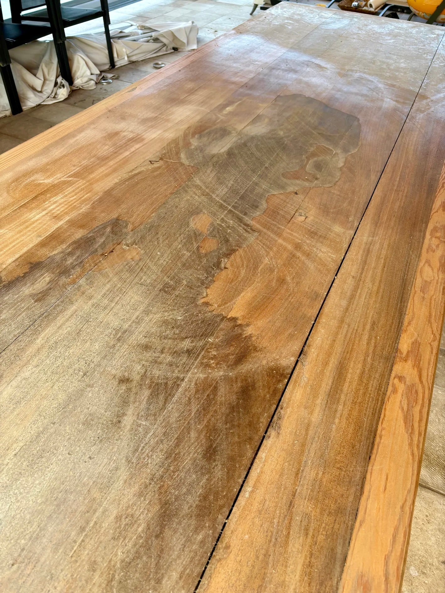 Large wooden surface with visible grain and texture