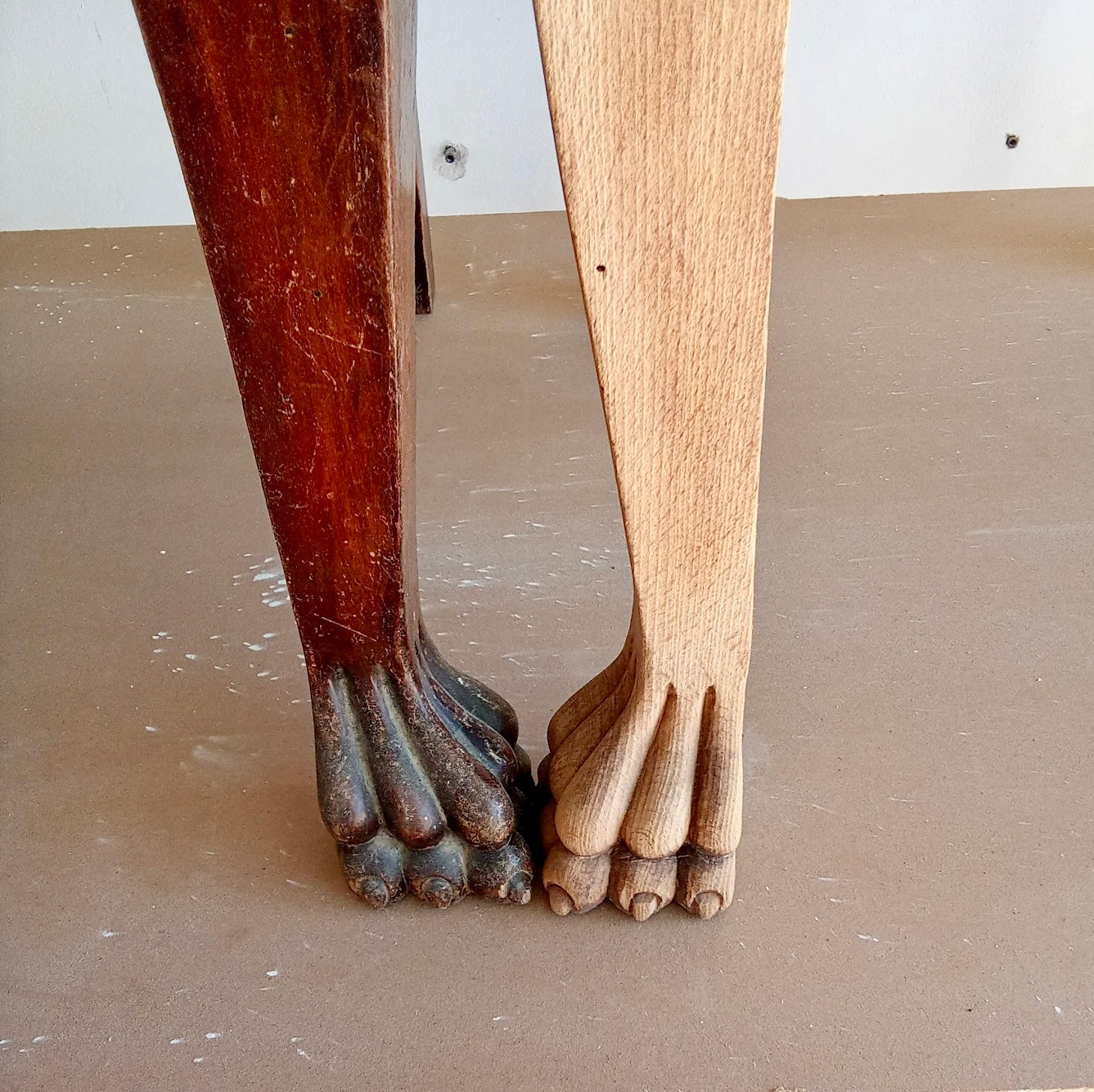 Wooden legs with feet on a plain background
