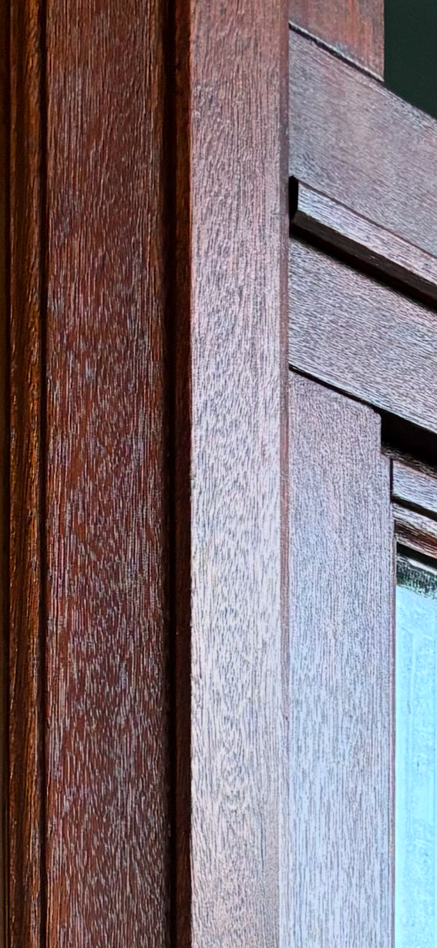 Close-up of wooden window frame with a focus on texture and color.